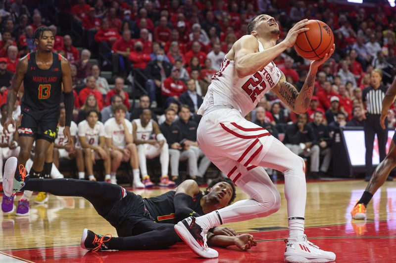 Jan 5, 2023; Piscataway, New Jersey, USA; Rutgers Scarlet Knights guard Caleb McConnell (22) is fouled by Maryland Terrapins guard Jahmir Young (1) during the second half at Jersey Mike's Arena. Mandatory Credit: Vincent Carchietta-USA TODAY Sports