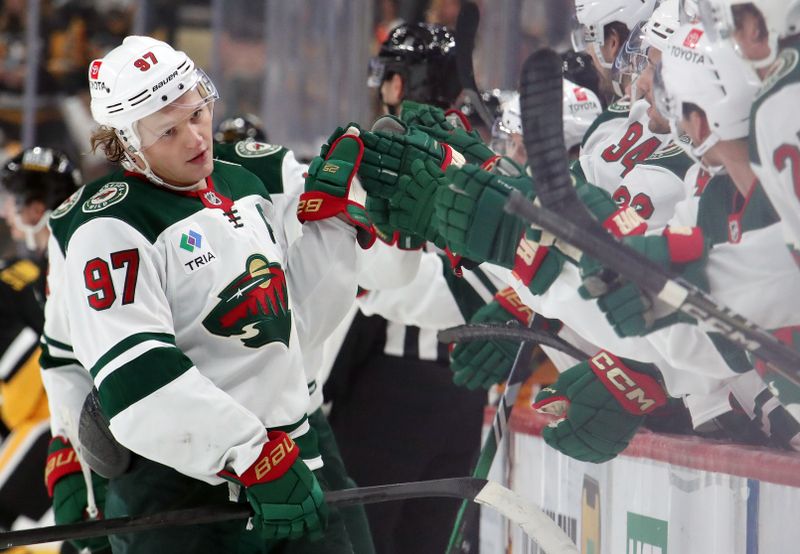 Oct 29, 2024; Pittsburgh, Pennsylvania, USA;  Minnesota Wild left wing Kirill Kaprizov (97) celebrates with the Wild bench after scoring a goal against the Pittsburgh Penguins during the third period at PPG Paints Arena. Mandatory Credit: Charles LeClaire-Imagn Images