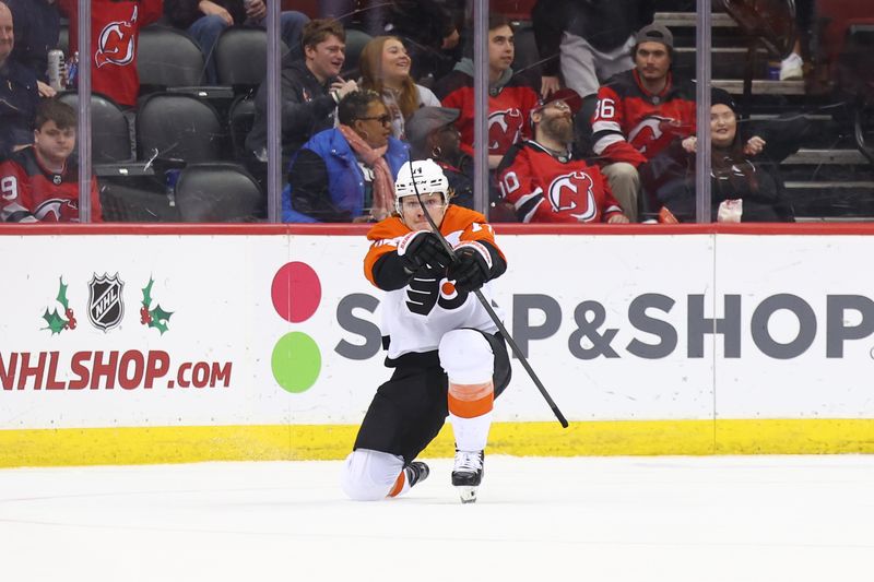 Dec 19, 2023; Newark, New Jersey, USA; Philadelphia Flyers right wing Owen Tippett (74) celebrates his game-winning goal against the New Jersey Devils during overtime at Prudential Center. Mandatory Credit: Ed Mulholland-USA TODAY Sports