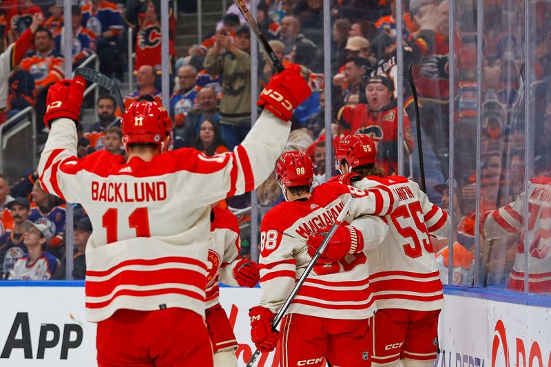 Feb 24, 2024; Edmonton, Alberta, CAN; The Calgary Flames celebrate a goal scored by defensemen Noah Hanifin (55) during the second period against the Edmonton Oilers at Rogers Place. Mandatory Credit: Perry Nelson-USA TODAY Sports