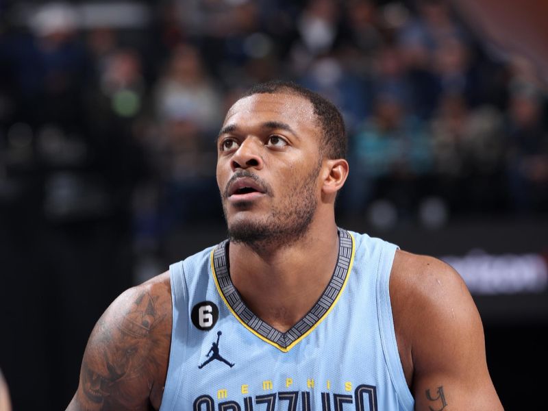 MEMPHIS, TN - MARCH 18: Xavier Tillman #2 of the Memphis Grizzlies prepares to shoot a free throw during the game against the Golden State Warriors on March 18, 2023 at FedExForum in Memphis, Tennessee. NOTE TO USER: User expressly acknowledges and agrees that, by downloading and or using this photograph, User is consenting to the terms and conditions of the Getty Images License Agreement. Mandatory Copyright Notice: Copyright 2023 NBAE (Photo by Joe Murphy/NBAE via Getty Images)