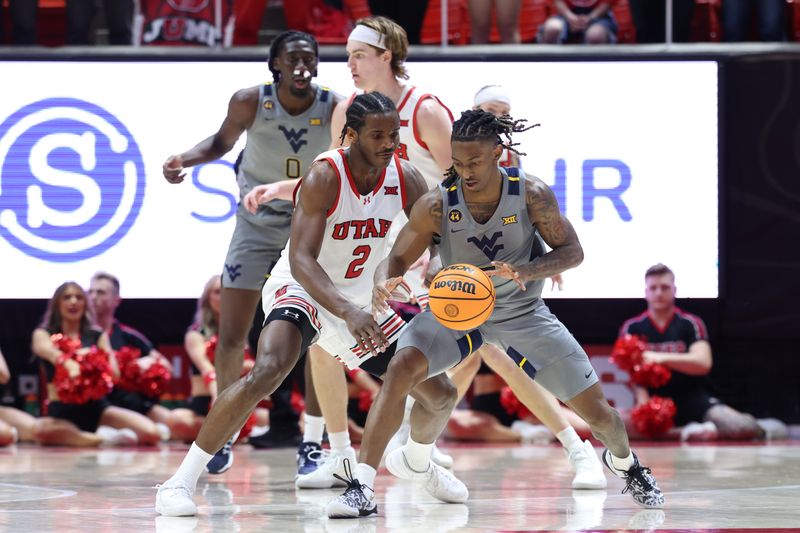 Mar 4, 2025; Salt Lake City, Utah, USA; West Virginia Mountaineers guard Javon Small (7) dribbles the ball as Utah Utes forward Ezra Ausar (2) defends during the first half at Jon M. Huntsman Center. Mandatory Credit: Rob Gray-Imagn Images