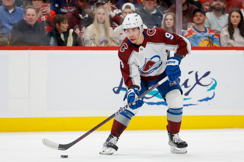 Feb 11, 2023; Sunrise, Florida, USA; Colorado Avalanche center Evan Rodrigues (9) moves the puck during the first period against the Florida Panthers at FLA Live Arena. Mandatory Credit: Sam Navarro-USA TODAY Sports