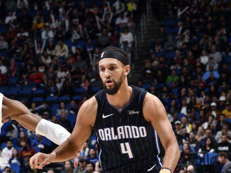 ORLANDO, FL - JANUARY 22: Jalen Suggs #4 of the Orlando Magic handles the ball during the game against the Cleveland Cavaliers on January 22, 2024 at Kia Center in Orlando, Florida. NOTE TO USER: User expressly acknowledges and agrees that, by downloading and or using this photograph, User is consenting to the terms and conditions of the Getty Images License Agreement. Mandatory Copyright Notice: Copyright 2024 NBAE (Photo by Fernando Medina/NBAE via Getty Images)