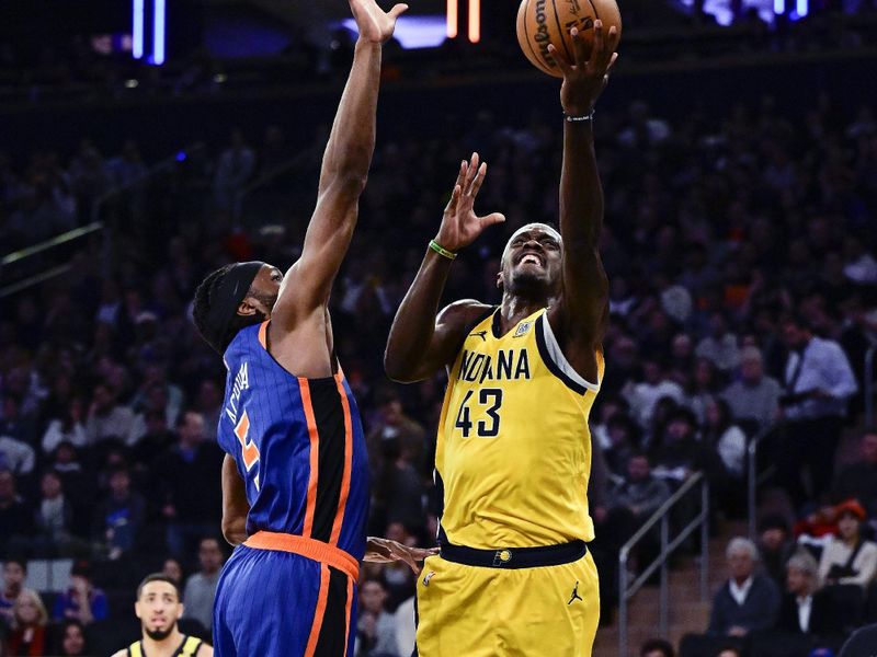 NEW YORK, NEW YORK - FEBRUARY 10:  Pascal Siakam #43 of the Indiana Pacers attempts a shot against Precious Achiuwa #5 of the New York Knicks during the first half at Madison Square Garden on February 10, 2024 in New York City. NOTE TO USER: User expressly acknowledges and agrees that, by downloading and or using this photograph, User is consenting to the terms and conditions of the Getty Images License Agreement. (Photo by Steven Ryan/Getty Images)