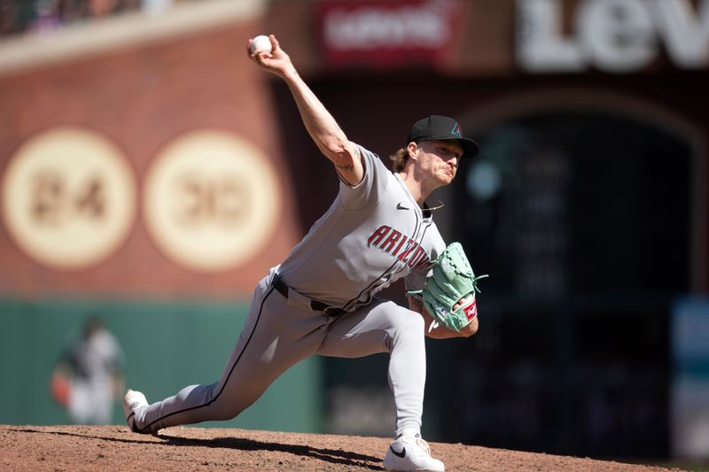 May 14, 2025; San Francisco, California, USA; Arizona Diamondbacks pitcher Shelby Miller (18) delivers a pitch against the San Francisco Giants during the ninth inning at Oracle Park. Mandatory Credit: D. Ross Cameron-Imagn Images