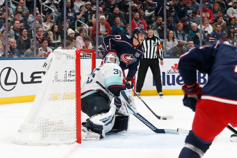 Mar 21, 2026; Columbus, Ohio, USA; Columbus Blue Jackets left wing Mason Marchment (17) looks to pass as Seattle Kraken goalie Joey Daccord (35) defends during the second period at Nationwide Arena. Mandatory Credit: Russell LaBounty-Imagn Images
