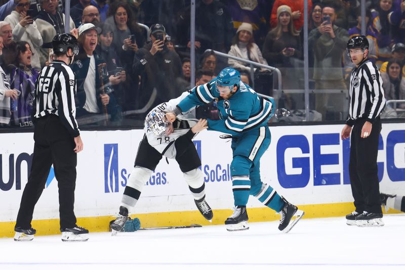 Dec 27, 2023; Los Angeles, California, USA; San Jose Sharks center Luke Kunin (11) and Los Angeles Kings right wing Alex Laferriere (78) fight during the third period of a game at Crypto.com Arena. Mandatory Credit: Jessica Alcheh-USA TODAY Sports