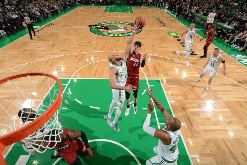 BOSTON, MA - APRIL 21: Derrick White #9 of the Boston Celtics blocks a shot during the game against the Miami Heat during Round 1 Game 1 of the 2024 NBA Playoffs on April 21, 2024 at the TD Garden in Boston, Massachusetts. NOTE TO USER: User expressly acknowledges and agrees that, by downloading and or using this photograph, User is consenting to the terms and conditions of the Getty Images License Agreement. Mandatory Copyright Notice: Copyright 2024 NBAE  (Photo by Brian Babineau/NBAE via Getty Images)