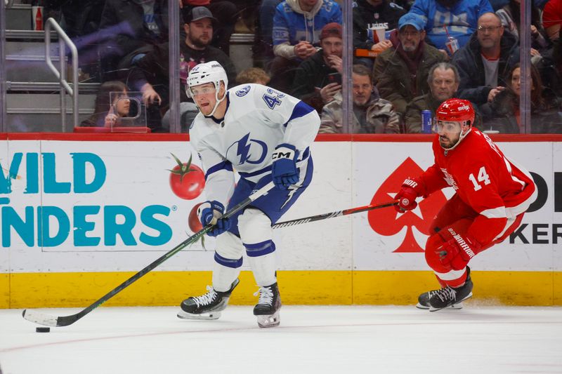 Jan 21, 2024; Detroit, Michigan, USA; Tampa Bay Lightning defenseman Darren Raddysh (43) handles the puck during the second period against the Detroit Red Wings at Little Caesars Arena. Mandatory Credit: Brian Bradshaw Sevald-USA TODAY Sports