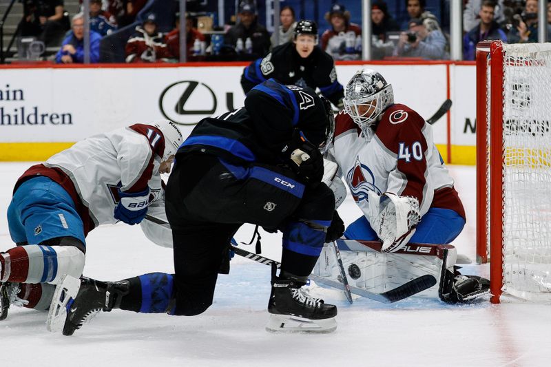 Feb 24, 2024; Denver, Colorado, USA; Colorado Avalanche goaltender Alexandar Georgiev (40) makes a save against Toronto Maple Leafs defenseman Morgan Rielly (44) as center Andrew Cogliano (11) defends in the third period at Ball Arena. Mandatory Credit: Isaiah J. Downing-USA TODAY Sports