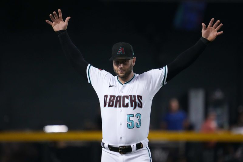 Jul 30, 2023; Phoenix, Arizona, USA; Arizona Diamondbacks first baseman Christian Walker (53) stretches prior the first inning of the game against the Seattle Mariners at Chase Field. Mandatory Credit: Joe Camporeale-USA TODAY Sports