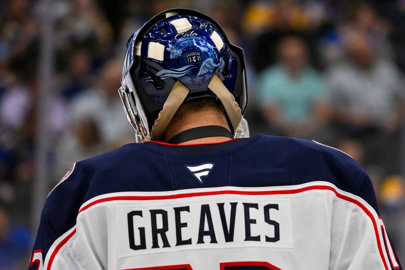 Oct 1, 2024; St. Louis, Missouri, USA;  A detailed view of Columbus Blue Jackets goaltender Jet Greaves (73) goalie mask honoring Johnny and Matthew Gaudreau during the second period against the St. Louis Blues at Enterprise Center. Mandatory Credit: Jeff Curry-Imagn Images