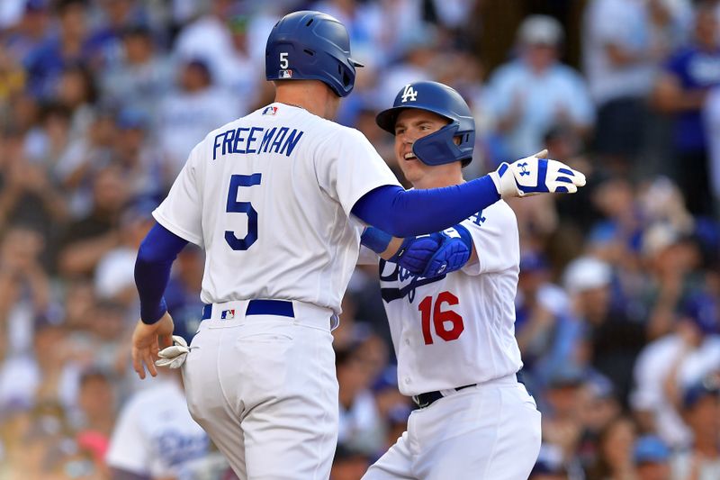 Jun 25, 2023; Los Angeles, California, USA; Los Angeles Dodgers catcher Will Smith (16) is greeted by first baseman Freddie Freeman (5) after hitting a two run home run against the Houston Astros during the eighth inning at Dodger Stadium. Mandatory Credit: Gary A. Vasquez-USA TODAY Sports