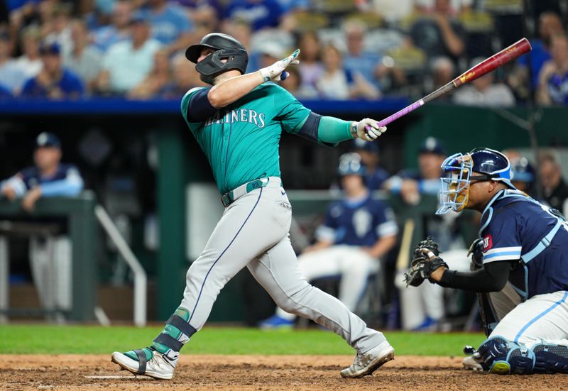 Jun 7, 2024; Kansas City, Missouri, USA; Seattle Mariners first baseman Ty France (23) hits a double during the eighth inning against the Kansas City Royals at Kauffman Stadium. Mandatory Credit: Jay Biggerstaff-USA TODAY Sports