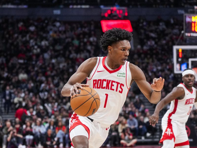 TORONTO, ON - FEBRUARY 9: Amen Thompson #1 of the Houston Rockets dribbles against the Toronto Raptors during the second half of their basketball game at the Scotiabank Arena on February 9, 2024 in Toronto, Ontario, Canada. NOTE TO USER: User expressly acknowledges and agrees that, by downloading and/or using this Photograph, user is consenting to the terms and conditions of the Getty Images License Agreement. (Photo by Mark Blinch/Getty Images)