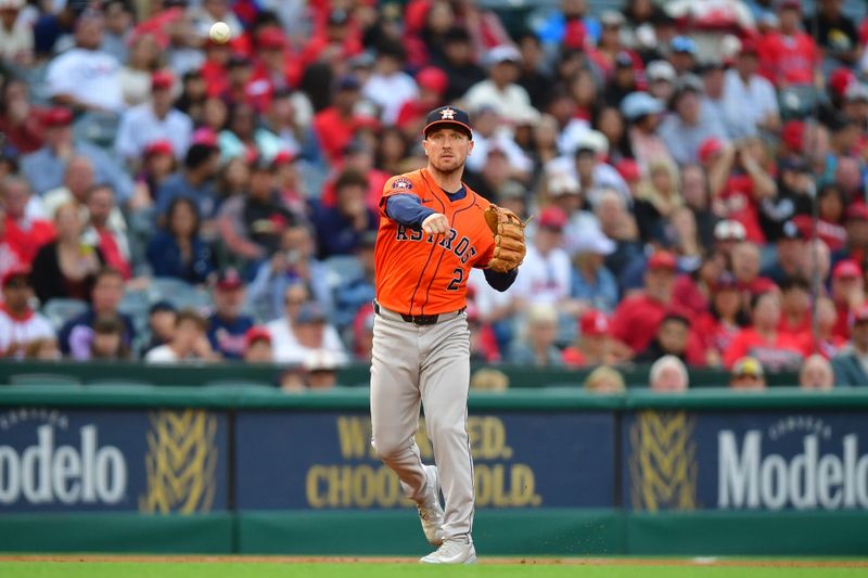 Jun 7, 2024; Anaheim, California, USA; Houston Astros third base Alex Bregman (2) throws to first for the out against Los Angeles Angels second base Kyren Paris (19) during the third inning at Angel Stadium. Mandatory Credit: Gary A. Vasquez-USA TODAY Sports