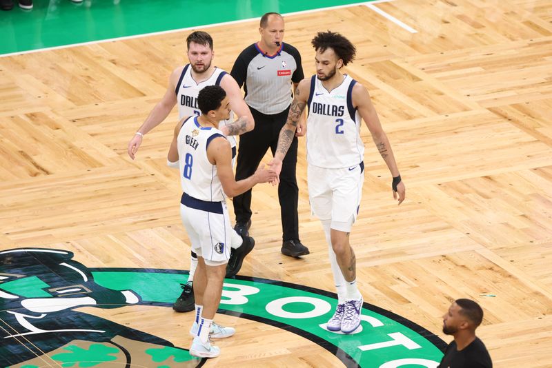 BOSTON, MA - JUNE 17: Dereck Lively II #2 and Josh Green #8 of the Dallas Mavericks high five during the game against the Boston Celtics during Game 5 of the 2024 NBA Finals on June 17, 2024 at TD Garden in Boston, Massachusetts. NOTE TO USER: User expressly acknowledges and agrees that, by downloading and or using this photograph, User is consenting to the terms and conditions of the Getty Images License Agreement. Mandatory Copyright Notice: Copyright 2024 NBAE  (Photo by Joe Murphy/NBAE via Getty Images)