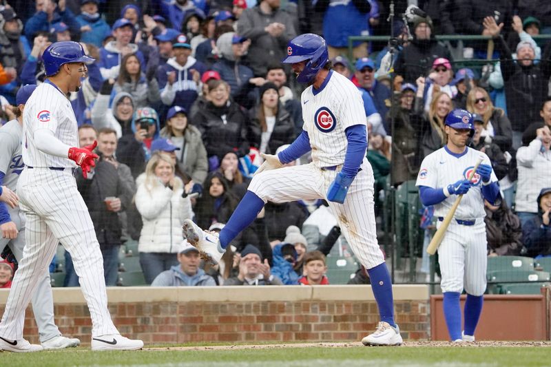 Apr 7, 2024; Chicago, Illinois, USA; Chicago Cubs shortstop Dansby Swanson (7) reacts after scoring a run against the Los Angeles Dodgers during the first inning at Wrigley Field. Mandatory Credit: David Banks-USA TODAY Sports