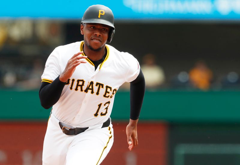 Jul 8, 2024; Pittsburgh, Pennsylvania, USA;  Pittsburgh Pirates third baseman Ke'Bryan Hayes (13) runs from first base to third base against the New York Mets during the eighth inning at PNC Park.  The Pirates won 8-2. Mandatory Credit: Charles LeClaire-USA TODAY Sports