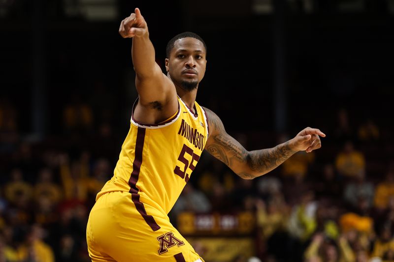 Dec 11, 2022; Minneapolis, Minnesota, USA; Minnesota Golden Gophers guard Ta'lon Cooper (55) reacts to his three point shot against the Mississippi State Bulldogs during the first half at Williams Arena. Mandatory Credit: Matt Krohn-USA TODAY Sports