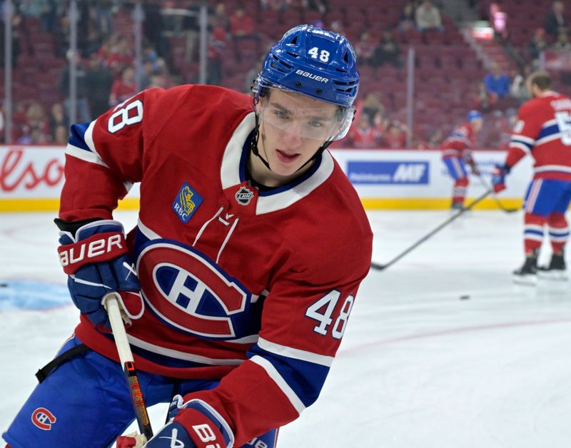 Sep 23, 2024; Montreal, Quebec, CAN; Montreal Canadiens defenseman Lane Hutson (48) warms up before  game against the Philadelphia Flyers at the Bell Centre. Mandatory Credit: Eric Bolte-Imagn Images