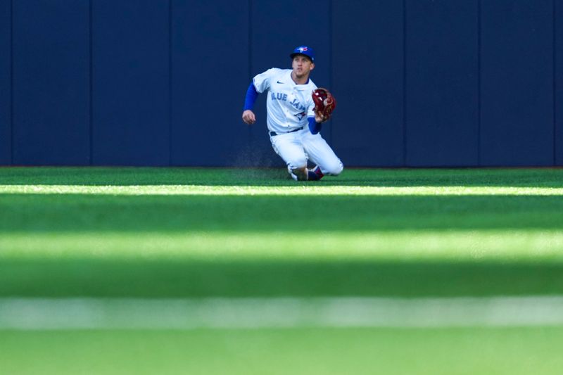 May 15, 2025; Toronto, Ontario, CAN; Toronto Blue Jays outfielder Myles Straw (3) makes a catch against the Tampa Bay Rays during the sixth inning at Rogers Centre. Mandatory Credit: Kevin Sousa-Imagn Images