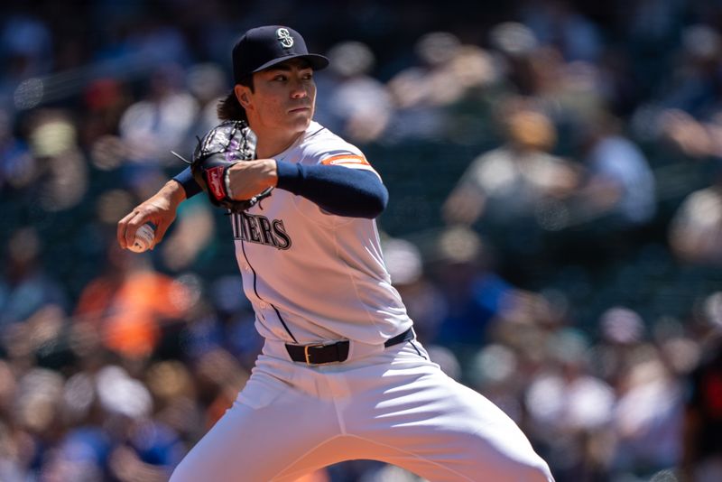 Jun 5, 2025; Seattle, Washington, USA;  Seattle Mariners starter Bryan Woo (22) delivers a pitch during the first inning against the Baltimore Orioles at T-Mobile Park. Mandatory Credit: Stephen Brashear-Imagn Images