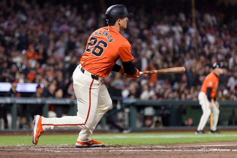 Aug 30, 2024; San Francisco, California, USA; San Francisco Giants third baseman Matt Chapman (26) hits a three-RBI double against the Miami Marlins during the eighth inning at Oracle Park. Mandatory Credit: John Hefti-USA TODAY Sports