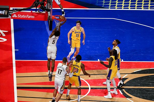 LAS VEGAS, NEVADA - DECEMBER 7: Austin Reaves (15) of Los Angeles Lakers and Herbert Jones (5) of New Orleans Pelicans in action during NBA In-Season Tournament Semifinals game between Los Angeles Lakers and New Orleans Pelicans at the T-Mobile Arena in Las Vegas, Nevada, United States on December 7, 2023. (Photo by Tayfun Coskun/Anadolu via Getty Images)