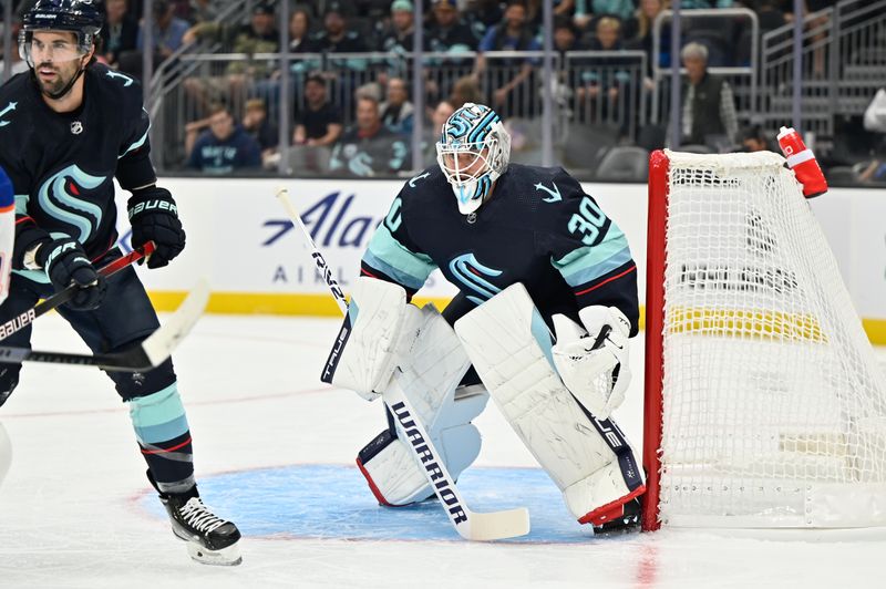 Sep 26, 2022; Seattle, Washington, USA; Seattle Kraken goaltender Martin Jones (30) defends the goal during the first period against the Edmonton Oilers at Climate Pledge Arena. Mandatory Credit: Steven Bisig-USA TODAY Sports