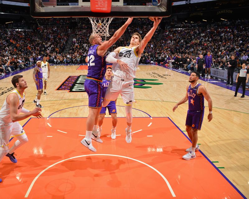 PHOENIX, AZ - JANUARY 11: Lauri Markkanen #23 of the Utah Jazz drives to the basket during the game against the Phoenix Suns on January 11, 2025 at Footprint Center in Phoenix, Arizona. NOTE TO USER: User expressly acknowledges and agrees that, by downloading and or using this photograph, user is consenting to the terms and conditions of the Getty Images License Agreement. Mandatory Copyright Notice: Copyright 2025 NBAE (Photo by Barry Gossage/NBAE via Getty Images)