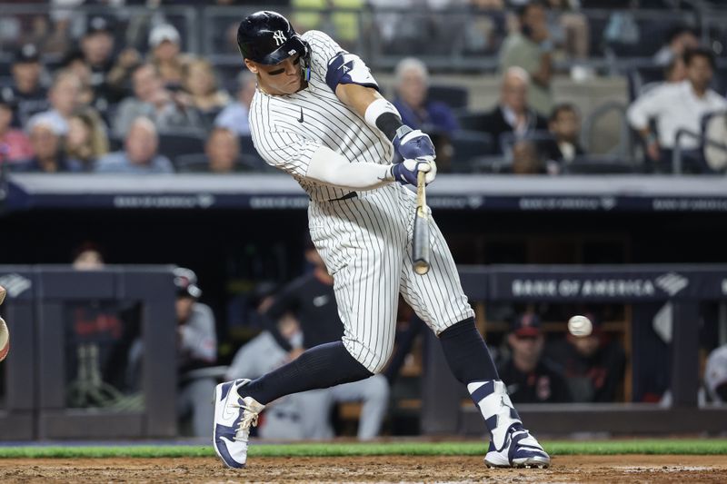 Jun 4, 2025; Bronx, New York, USA;  New York Yankees right fielder Aaron Judge (99) hits a single in the sixth inning against the Cleveland Guardians at Yankee Stadium. Mandatory Credit: Wendell Cruz-Imagn Images