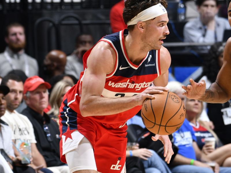 ORLANDO, FL - NOVMEBER 10: Corey Kispert #24 of the Washington Wizards drives to the basket during the game against the Orlando Magic on November 10, 2024 at Kia Center in Orlando, Florida. NOTE TO USER: User expressly acknowledges and agrees that, by downloading and or using this photograph, User is consenting to the terms and conditions of the Getty Images License Agreement. Mandatory Copyright Notice: Copyright 2024 NBAE (Photo by Fernando Medina/NBAE via Getty Images)