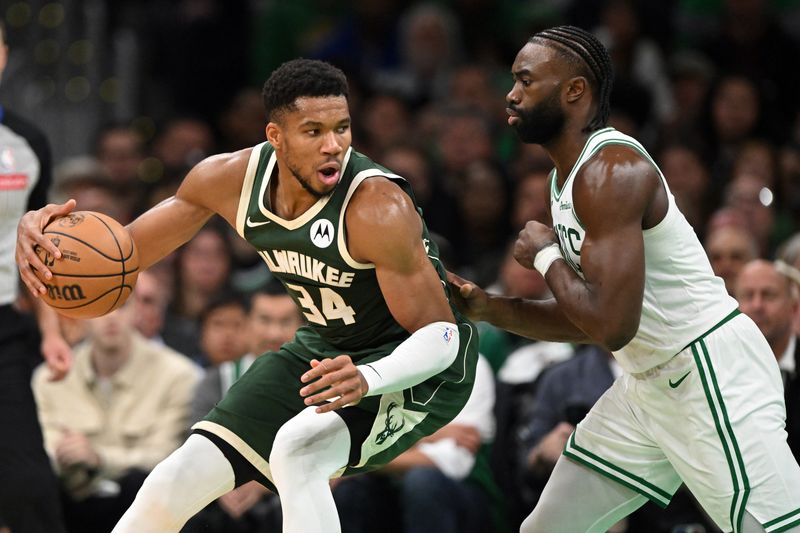 BOSTON, MASSACHUSETTS - OCTOBER 28: Giannis Antetokounmpo #34 of the Milwaukee Bucks controls the ball against Jaylen Brown #7 of the Boston Celtics during the second half at the TD Garden on October 28, 2024 in Boston, Massachusetts. NOTE TO USER: User expressly acknowledges and agrees that, by downloading and or using this photograph, User is consenting to the terms and conditions of the Getty Images License Agreement. (Photo by Brian Fluharty/Getty Images)