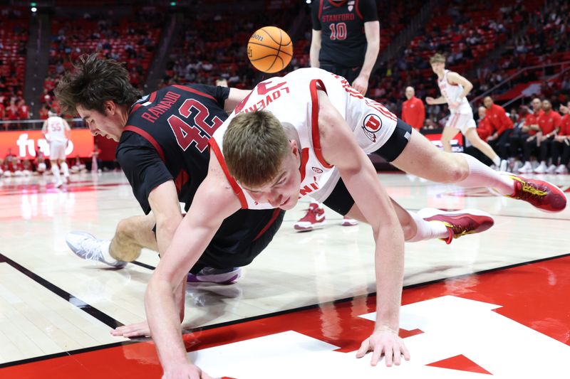 Feb 29, 2024; Salt Lake City, Utah, USA; Stanford Cardinal forward Maxime Raynaud (42) and Utah Utes center Lawson Lovering (34) fall to the floor during the second half at Jon M. Huntsman Center. Mandatory Credit: Rob Gray-USA TODAY Sports