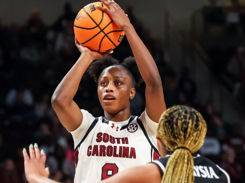 Dec 28, 2025; Columbia, South Carolina, USA; South Carolina Gamecocks forward Joyce Edwards (8) shoots over Providence Friars forward Nalani Kaysia (8) in the first half at Colonial Life Arena. Mandatory Credit: Jeff Blake-Imagn Images