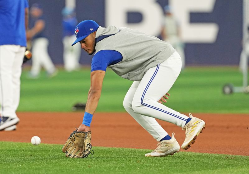 Aug 6, 2024; Toronto, Ontario, CAN; Toronto Blue Jays shortstop Leo Jimenez (49) fields balls during batting practice before a game against the Baltimore Orioles at Rogers Centre. Mandatory Credit: Nick Turchiaro-USA TODAY Sports