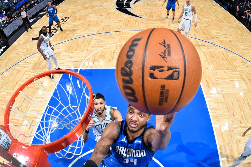 ORLANDO, FL - APRIL 25: Wendell Carter Jr. #34 of the Orlando Magic drives to the basket during Round One, Game Three of the 2025 NBA Playoffs against the Boston Celtics on April 25, 2025 at Kia Center in Orlando, Florida. NOTE TO USER: User expressly acknowledges and agrees that, by downloading and or using this photograph, User is consenting to the terms and conditions of the Getty Images License Agreement. Mandatory Copyright Notice: Copyright 2025 NBAE (Photo by Fernando Medina/NBAE via Getty Images)
