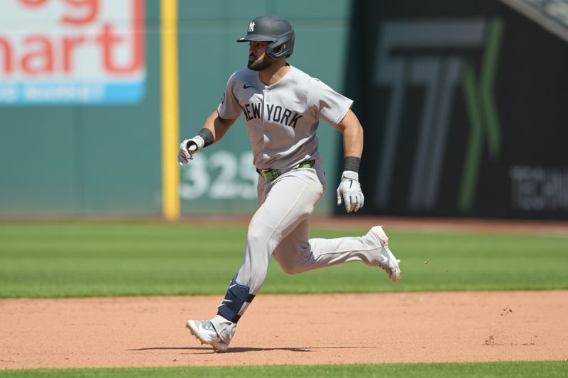 Apr 23, 2025; Cleveland, Ohio, USA; New York Yankees left fielder Jasson Dominguez (24) rounds the bases en route to a double during the fifth inning against the Cleveland Guardians at Progressive Field. Mandatory Credit: Ken Blaze-Imagn Images