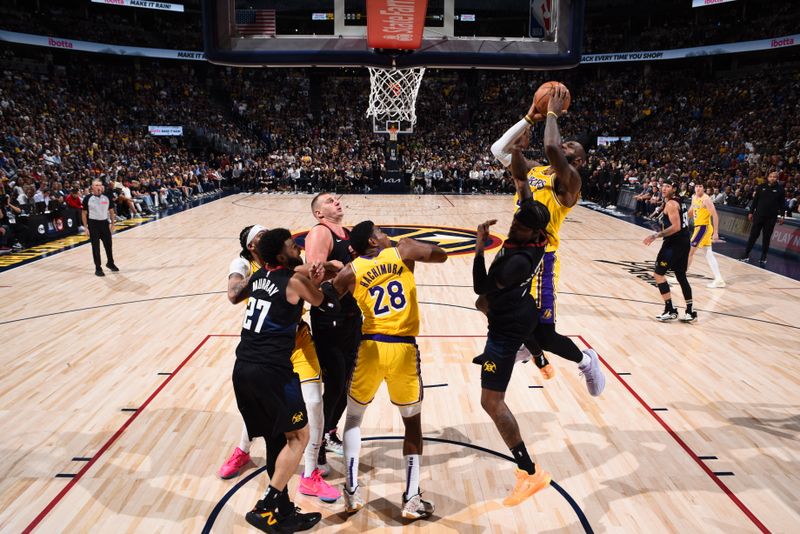 DENVER, CO - APRRIL 22: LeBron James #23 of the Los Angeles Lakers drives to the basket during the game against the Denver Nuggets during Round 1 Game 2 of the 2024 NBA Playoffs on April 22, 2024 at the Ball Arena in Denver, Colorado. NOTE TO USER: User expressly acknowledges and agrees that, by downloading and/or using this Photograph, user is consenting to the terms and conditions of the Getty Images License Agreement. Mandatory Copyright Notice: Copyright 2024 NBAE (Photo by Garrett Ellwood/NBAE via Getty Images)