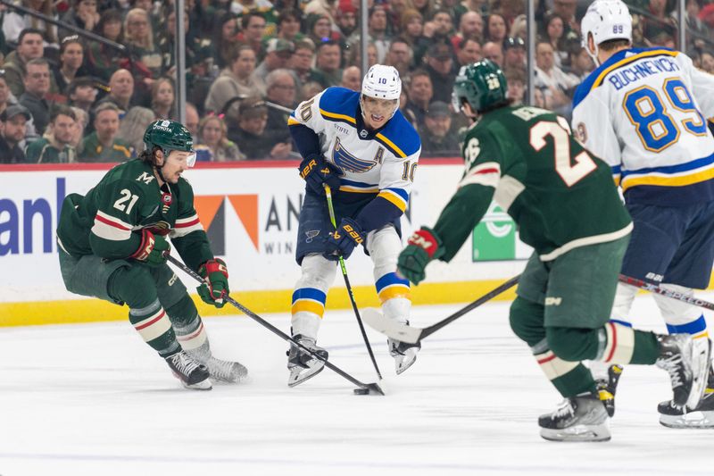 Apr 8, 2023; Saint Paul, Minnesota, USA; Minnesota Wild right wing Brandon Duhaime (21) steals the puck from St. Louis Blues center Brayden Schenn (10) in the first period at Xcel Energy Center. Mandatory Credit: Matt Blewett-USA TODAY Sports