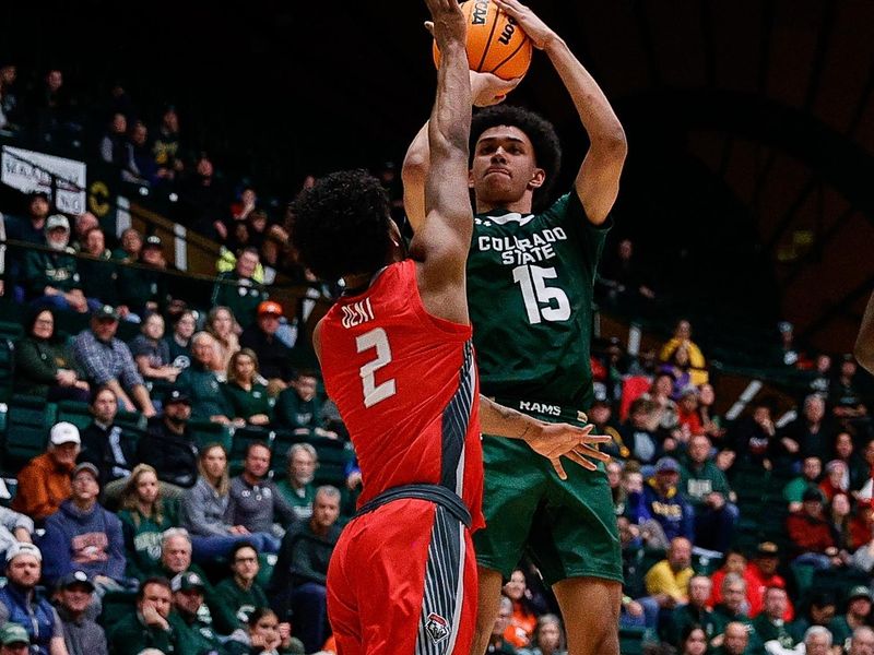 Mar 3, 2023; Fort Collins, Colorado, USA; Colorado State Rams guard Jalen Lake (15) attempts a shot as New Mexico Lobos guard Donovan Dent (2) defends in the second half at Moby Arena. Mandatory Credit: Isaiah J. Downing-USA TODAY Sports