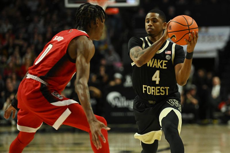 Jan 28, 2023; Winston-Salem, North Carolina, USA;  Wake Forest Demon Deacons guard Daivien Williamson (4) looks for a pass against North Carolina State Wolfpack guard Terquavion Smith (0) during the first half at Lawrence Joel Veterans Memorial Coliseum. Mandatory Credit: William Howard-USA TODAY Sports