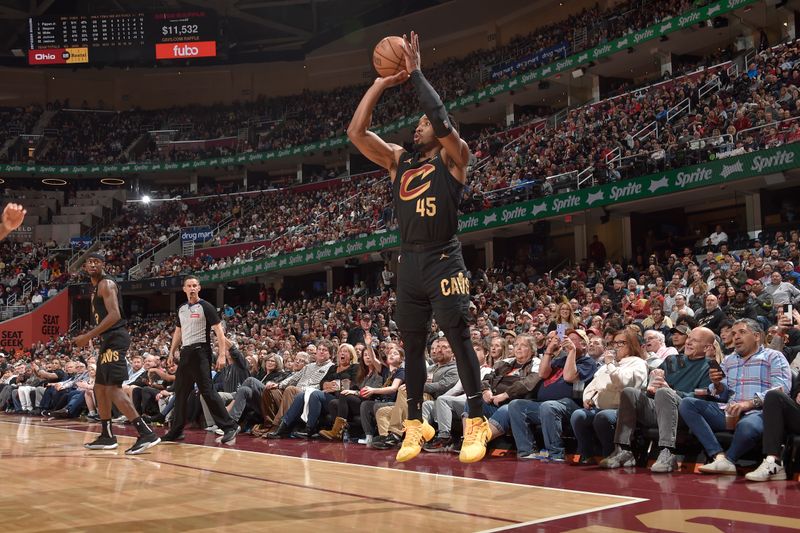 CLEVELAND, OH - APRIL 10: Donovan Mitchell #45 of the Cleveland Cavaliers shoots the ball during the game against the Memphis Grizzlies on April 10, 2024 at Rocket Mortgage FieldHouse in Cleveland, Ohio. NOTE TO USER: User expressly acknowledges and agrees that, by downloading and/or using this Photograph, user is consenting to the terms and conditions of the Getty Images License Agreement. Mandatory Copyright Notice: Copyright 2024 NBAE (Photo by David Liam Kyle/NBAE via Getty Images)