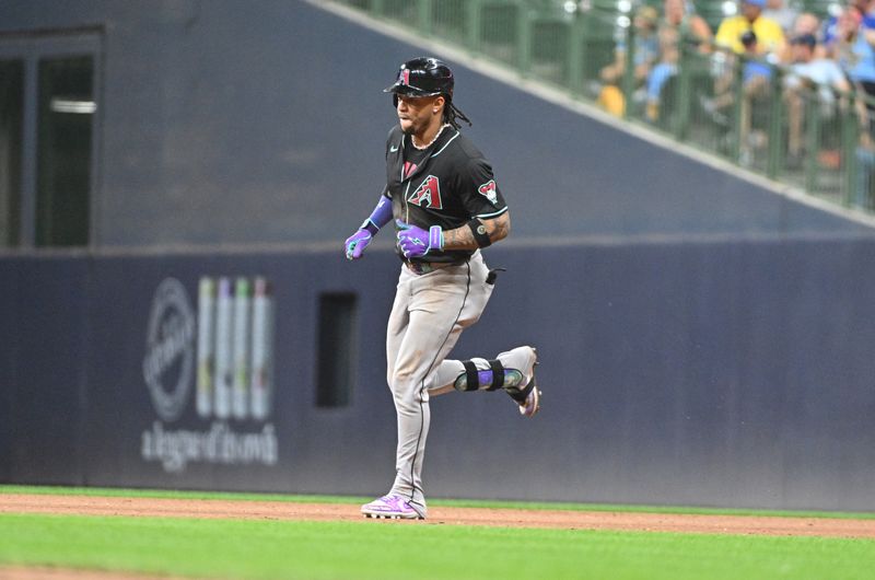 Sep 21, 2024; Milwaukee, Wisconsin, USA; Arizona Diamondbacks second base Ketel Marte (4) rounds the bases after hitting a home run against the Milwaukee Brewers in the ninth inning at American Family Field. Mandatory Credit: Michael McLoone-Imagn Images