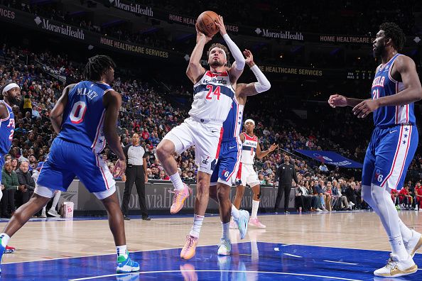 PHILADELPHIA, PA - DECEMBER 11: Corey Kispert #24 of the Washington Wizards drives to the basket during the game against the Philadelphia 76ers on December 11, 2023 at the Wells Fargo Center in Philadelphia, Pennsylvania NOTE TO USER: User expressly acknowledges and agrees that, by downloading and/or using this Photograph, user is consenting to the terms and conditions of the Getty Images License Agreement. Mandatory Copyright Notice: Copyright 2023 NBAE (Photo by Jesse D. Garrabrant/NBAE via Getty Images)