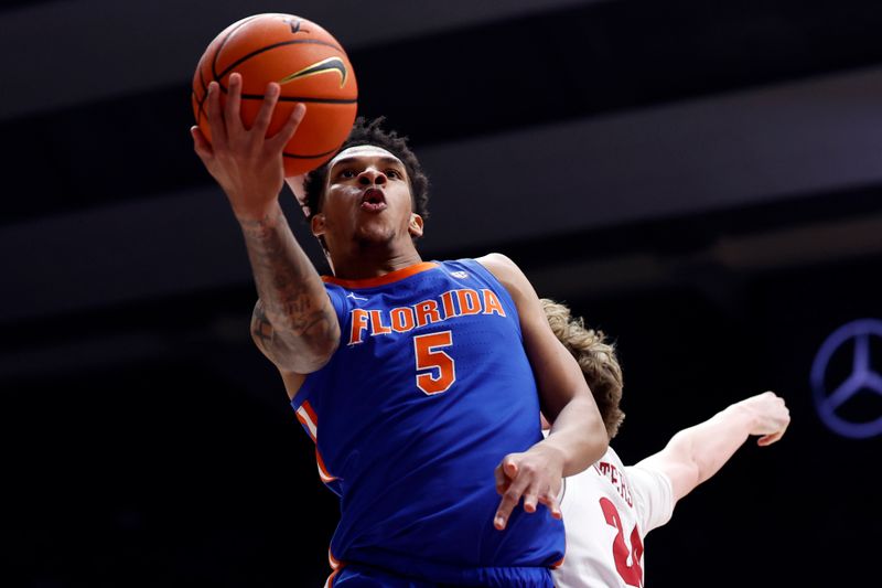 Feb 21, 2024; Tuscaloosa, Alabama, USA; Florida Gators guard Will Richard (5) lays in a basket during the second half against the Alabama Crimson Tide at Coleman Coliseum. Mandatory Credit: Butch Dill-USA TODAY Sports