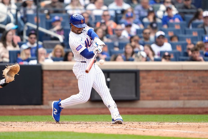 Jun 1, 2025; New York City, New York, USA; New York Mets shortstop Francisco Lindor (12) hits a home run against the Colorado Rockies during the fifth inning at Citi Field. Mandatory Credit: Gregory Fisher-Imagn Images