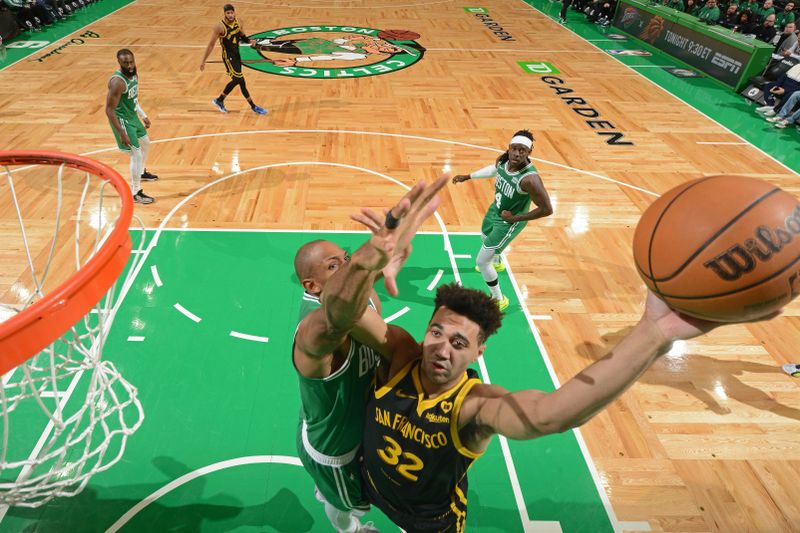 BOSTON, MA - MARCH 3: Trayce Jackson-Davis #32 of the Golden State Warriors drives to the basket during the game against the Boston Celtics on March 3, 2024 at the TD Garden in Boston, Massachusetts. NOTE TO USER: User expressly acknowledges and agrees that, by downloading and or using this photograph, User is consenting to the terms and conditions of the Getty Images License Agreement. Mandatory Copyright Notice: Copyright 2024 NBAE  (Photo by Brian Babineau/NBAE via Getty Images)